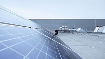 View of the solar modules and drycoolers from ebm-papst on the roof of a building